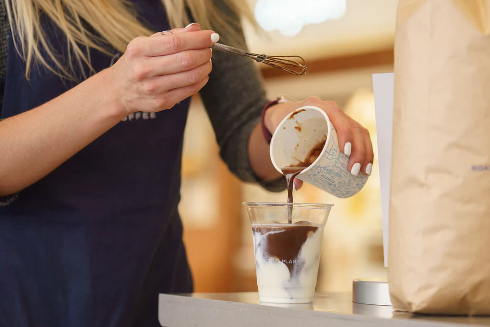 Pouring coffee into milk